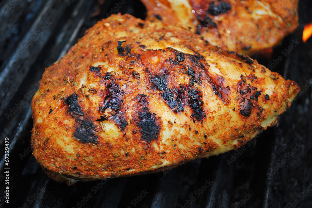 Close-Up of a Nutritious Chicken Breast Being Grilled Close-Up of a Nutritious Chicken Breast Being Grilled