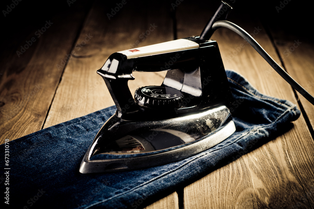 Old electric iron, touch-up in retro style Stock Photo | Adobe Stock