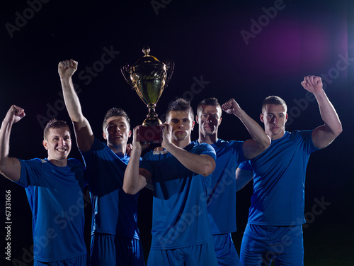 soccer players celebrating victory