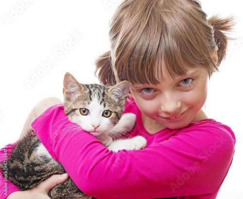 happly little girl holding a kitten photo