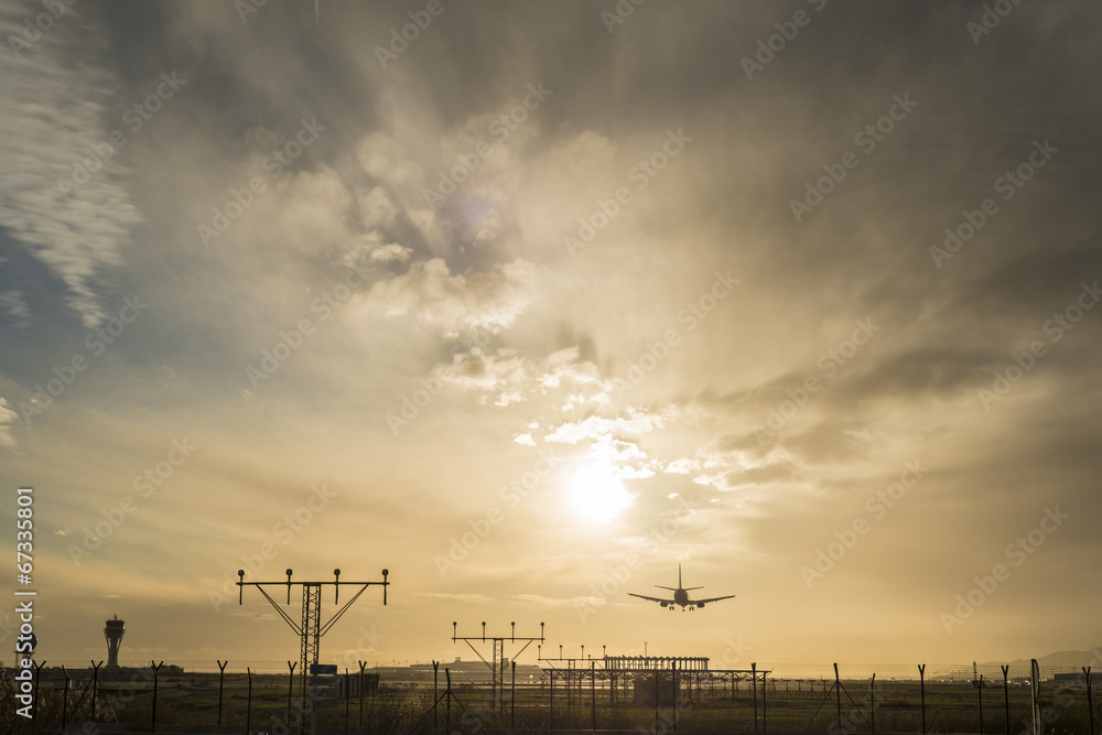 Airplane landing at dusk.