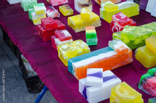 colorful soap with medical herbs sold in market photo