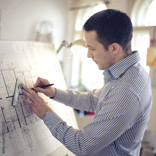 Architect Working On Blueprint