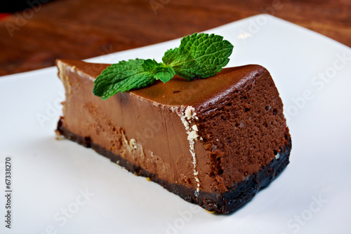 chocolate cheesecake on a white plate photo