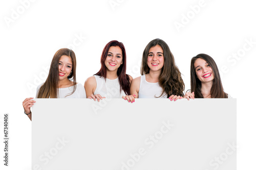 Group of girlfriends holding white board