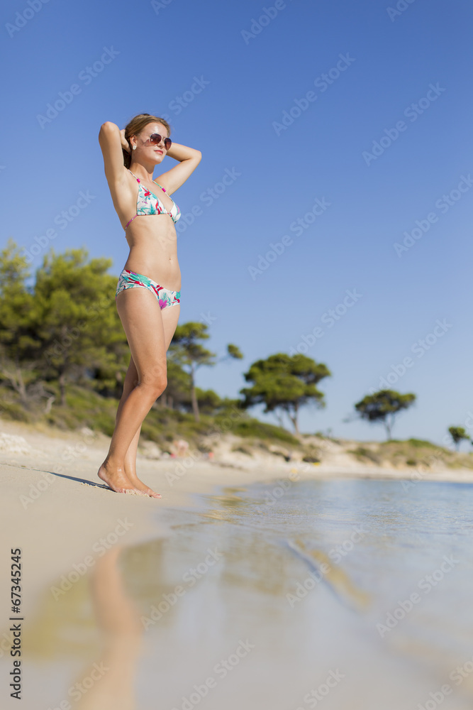 Fototapeta premium Young woman at the beach