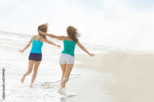 two young happy women enjoying life outdoors