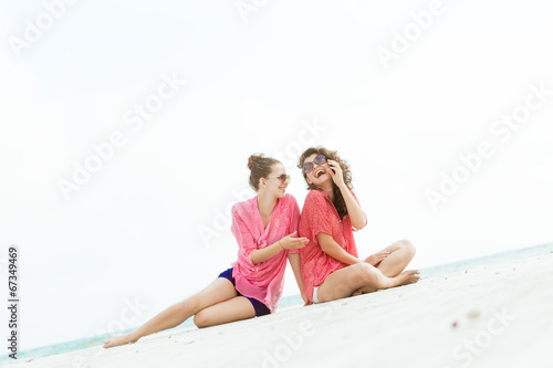 two young happy women on natural background © Alena Yakusheva