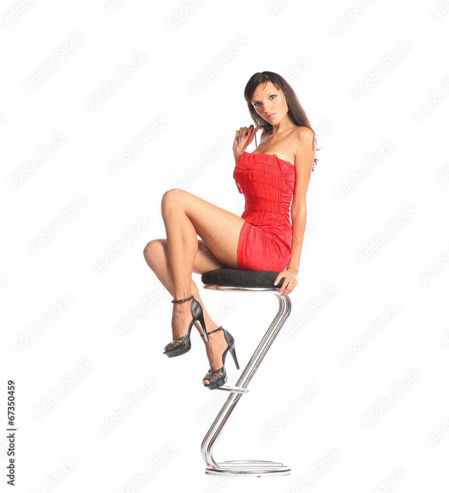 Young brunette woman red dress and court shoes bar chair Young brunette woman red dress and court shoes bar chair