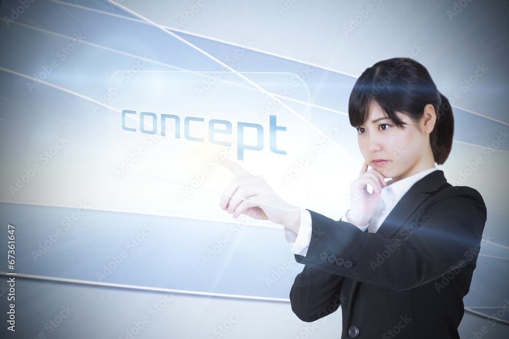 Businesswoman pointing to word concept Businesswoman pointing to word concept