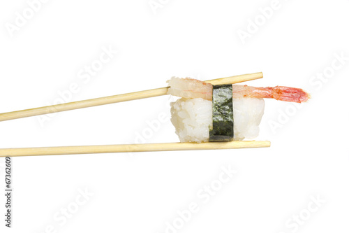 Shrimp nigiri in chopsticks isolated on white background