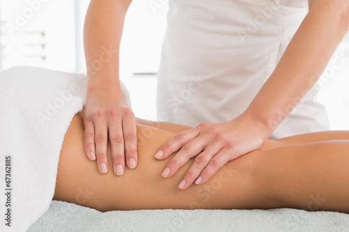 Close-up of a woman receiving leg massage