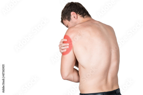 young man has pain in the shoulder