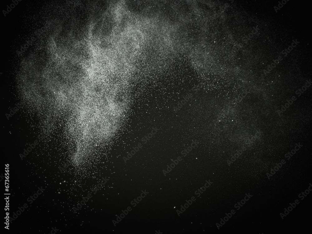 White powder exploding isolated on black White powder exploding isolated on black