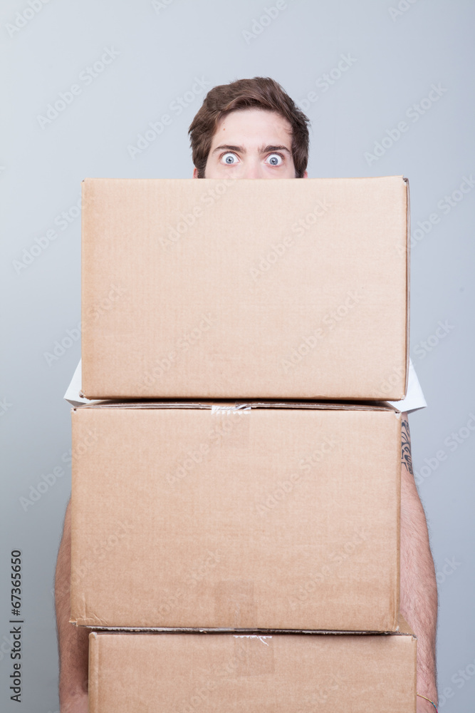 Young adult lifting boxes Young adult lifting boxes
