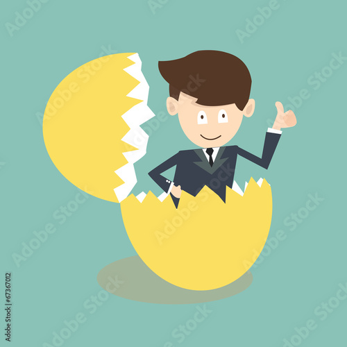 businessman breaking out of an eggshell