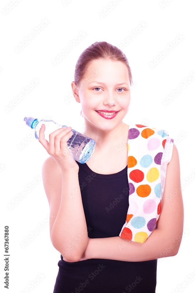 Teen girl holding towel and bottle of water Teen girl holding towel and bottle of water