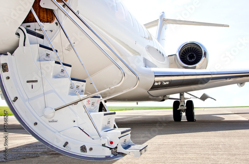 Fotótapéta Stairs with jet engine on a private airplane - Bombardier