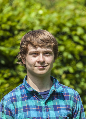  attractive happy smiling boy in the garden