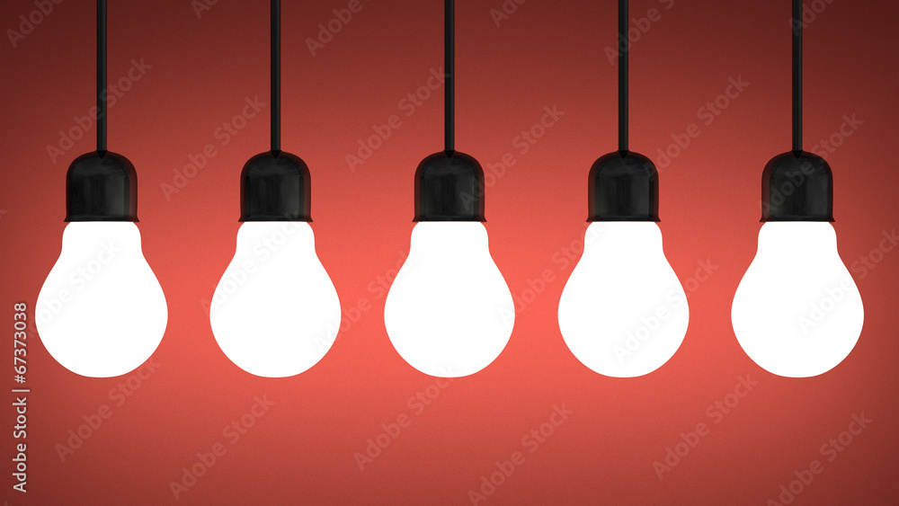 Hanging glowing tungsten light bulbs on red Hanging glowing tungsten light bulbs on red