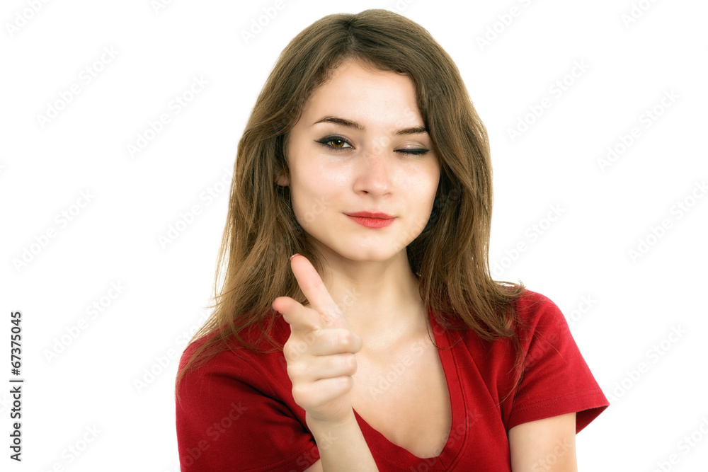 Young smiling woman points a hand with positive facial expressio Young smiling woman points a hand with positive facial expressio