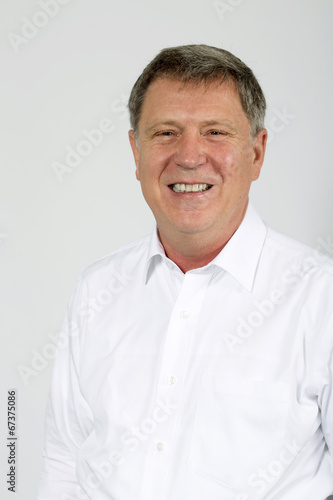 Portrait of young happy smiling business man, isolated over whit