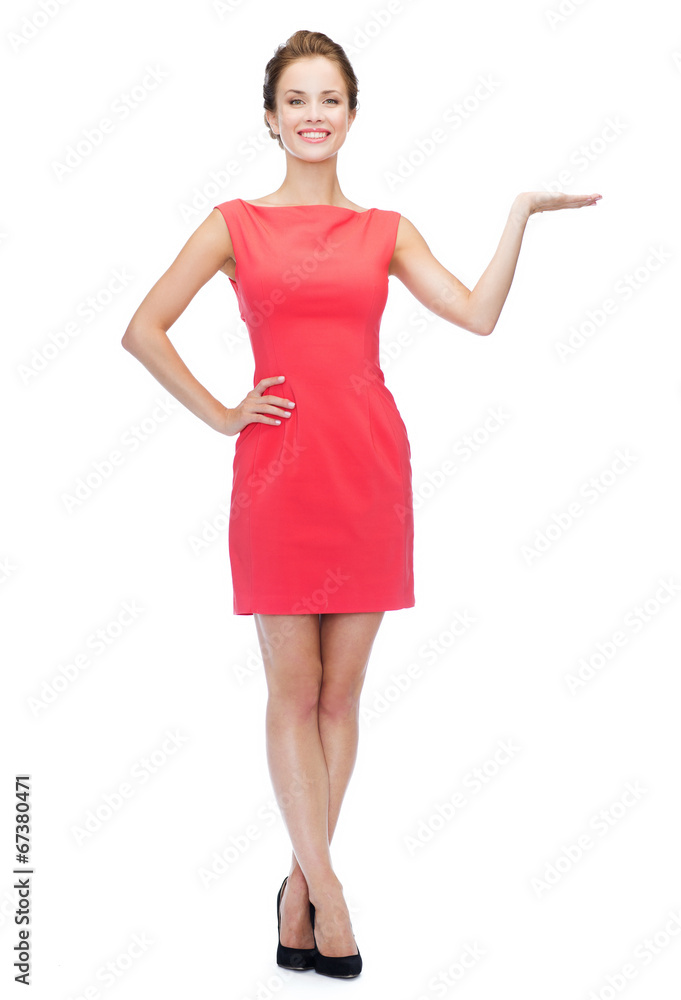 smiling woman holding something imaginary on palm smiling woman holding something imaginary on palm