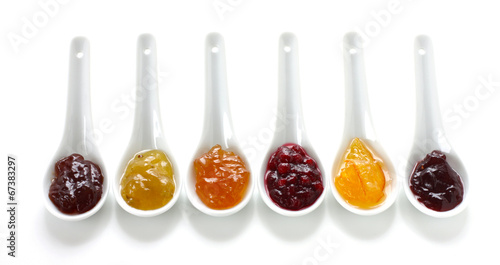Fruit jams in china spoons photo