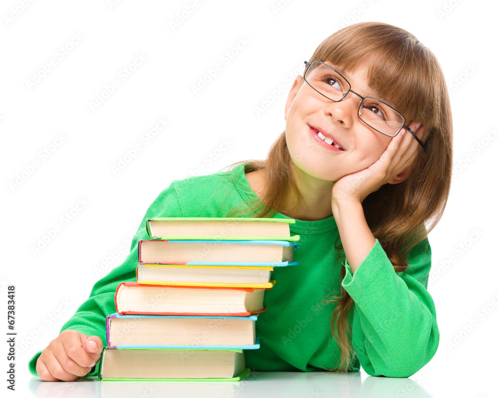 Young girl is daydreaming while reading book Young girl is daydreaming while reading book