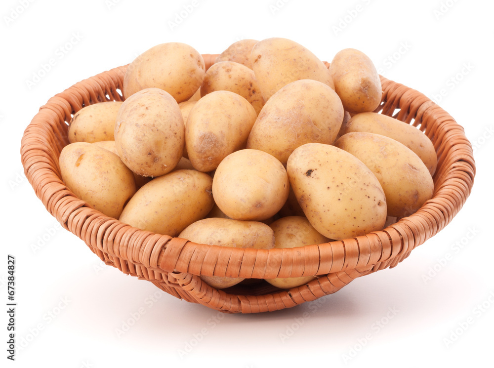 Potato tuber in wicker basket isolated on white background Potato tuber in wicker basket isolated on white background
