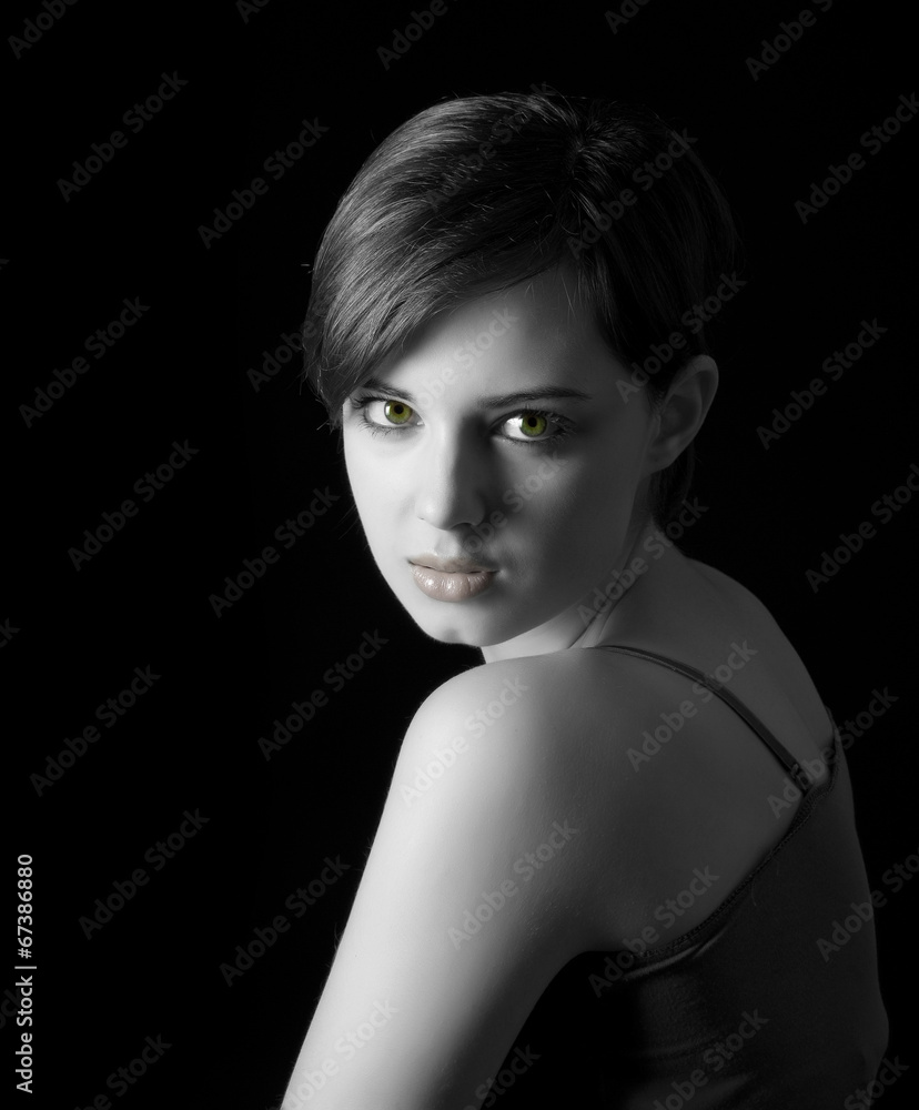 young woman with nice face on dark background young woman with nice face on dark background