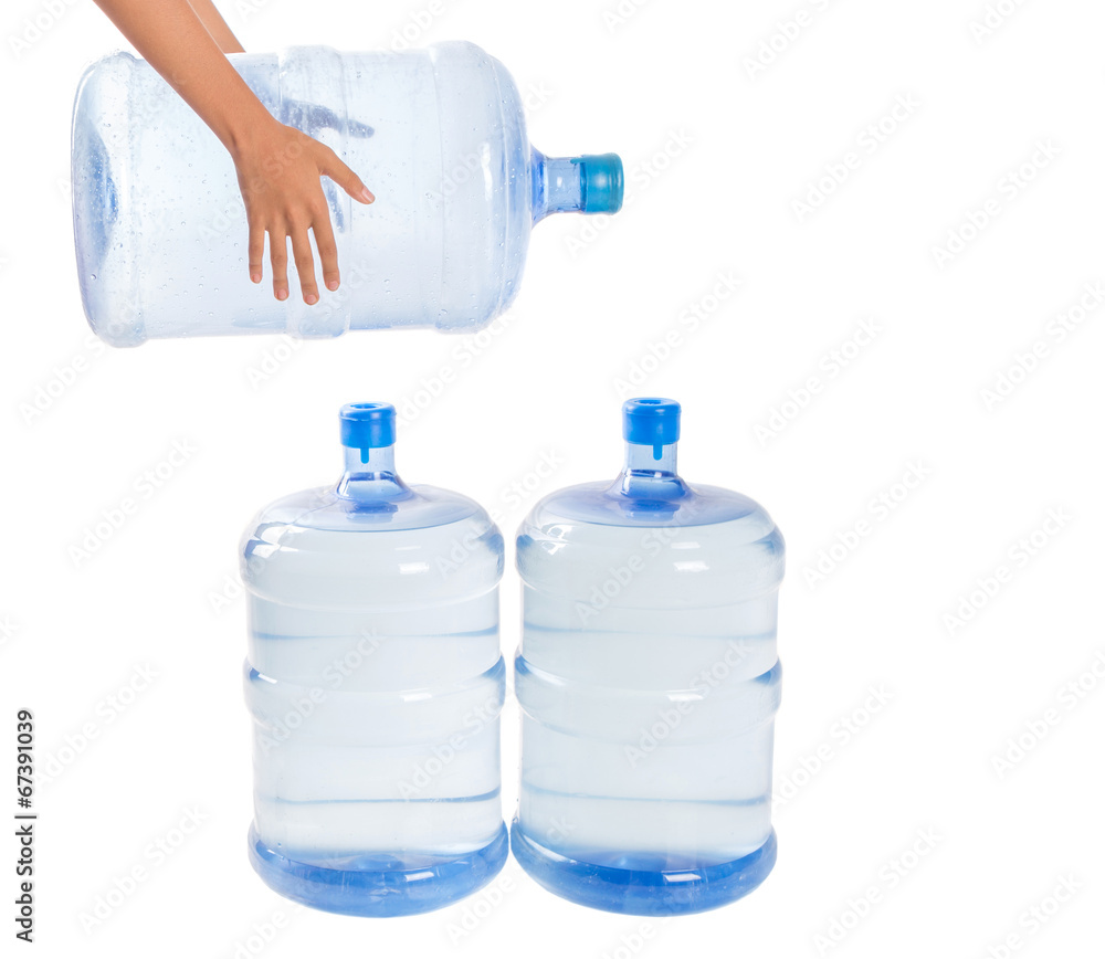 Girl hands with a large mineral water container Girl hands with a large mineral water container