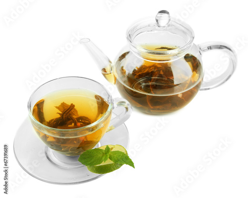 Cup and teapot of green tea isolated on white