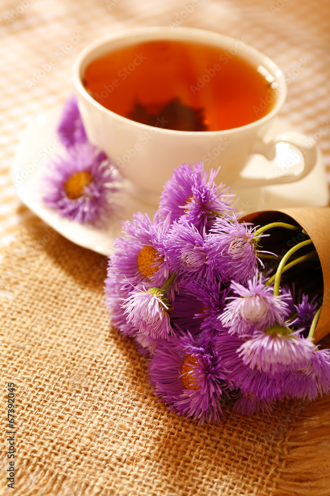 Cup of fresh herbal tea on table Cup of fresh herbal tea on table