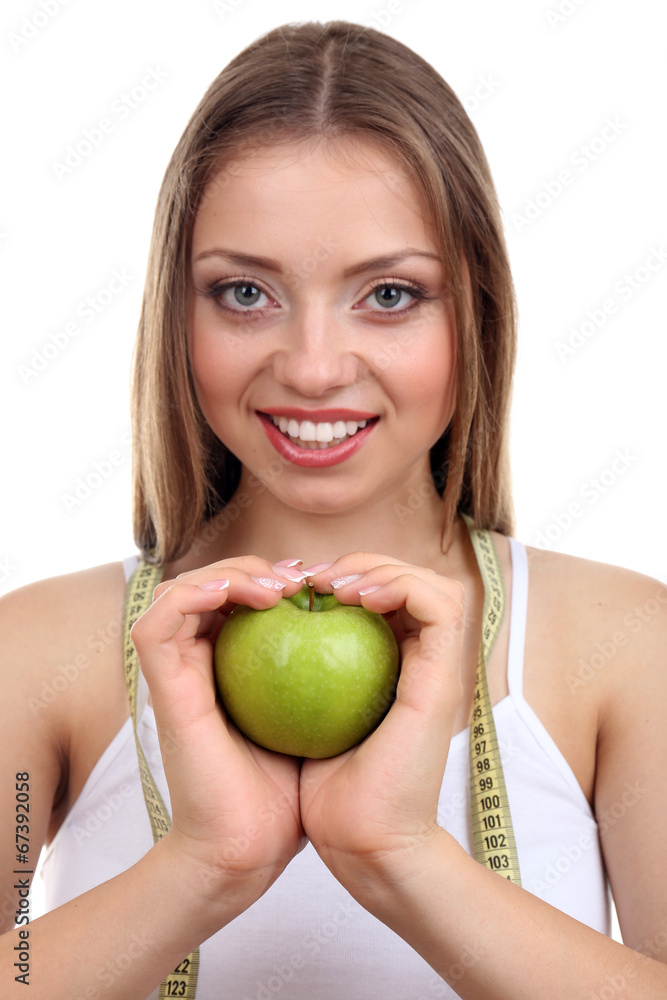 Beautiful girl with apple and measuring tape, isolated on white Beautiful girl with apple and measuring tape, isolated on white