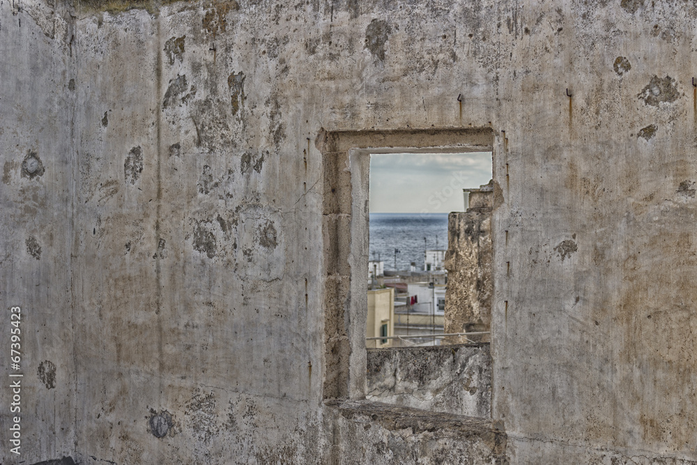 Square window on Doxi Stracca Fontana Palace in Gallipoli (Le)