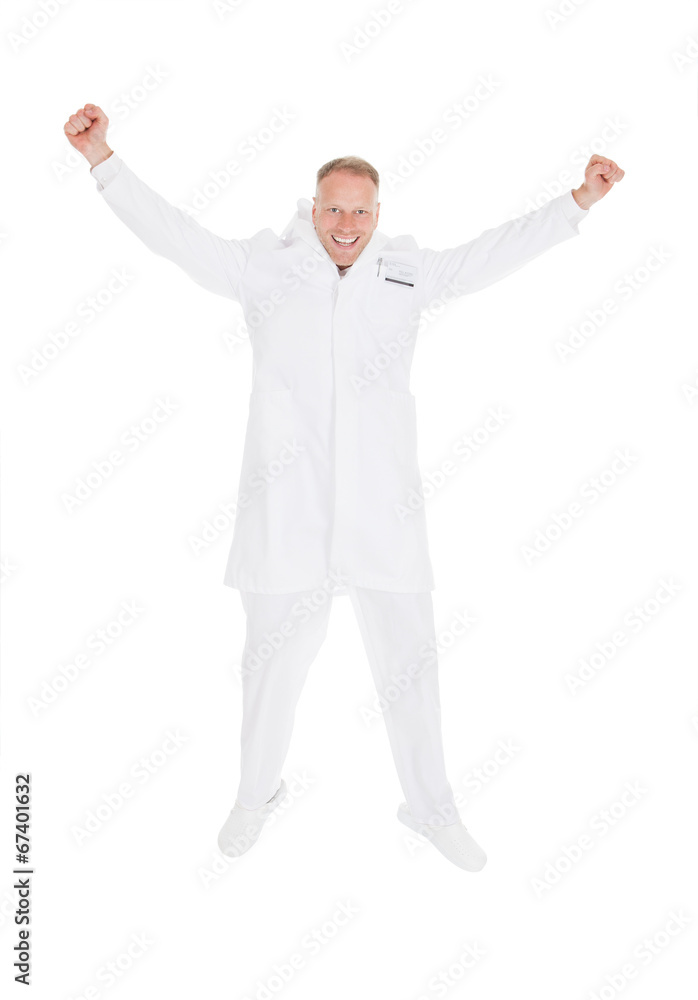 Successful Young Male Doctor With Arms Raised Successful Young Male Doctor With Arms Raised