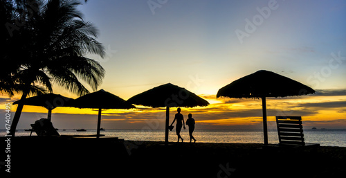 Gazebo and people silhouette with sunset background