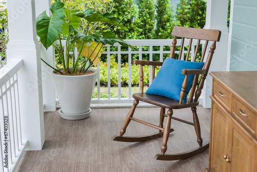 wooden rocking chair on front porch