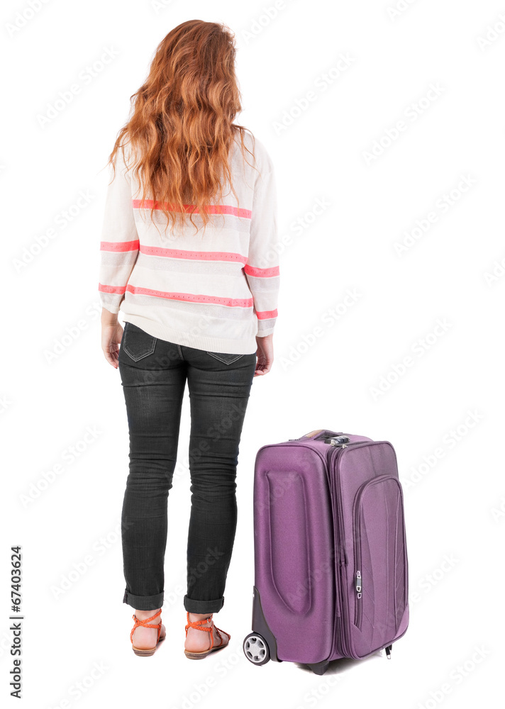 back view of walking woman with suitcase. back view of walking woman with suitcase.