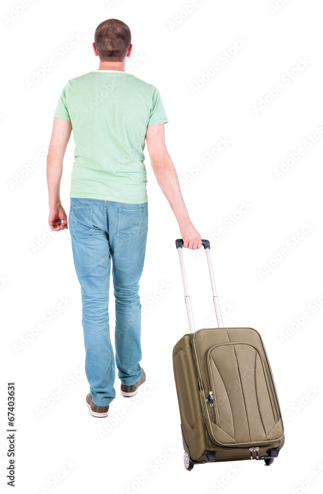 back view of walking man with suitcase. back view of walking man with suitcase.