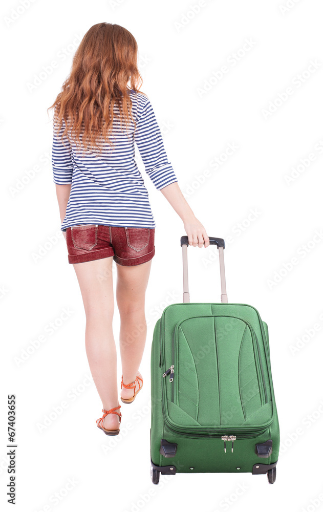 back view of walking woman with suitcase back view of walking woman with suitcase