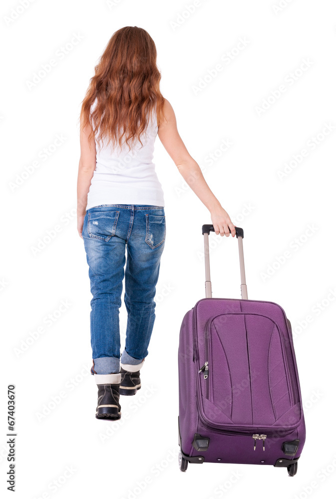 back view of walking woman with suitcase back view of walking woman with suitcase