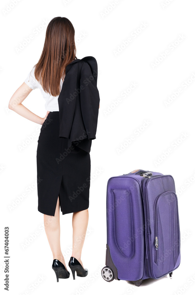 back view of thoughtful business woman traveling with suitcas. back view of thoughtful business woman traveling with suitcas.