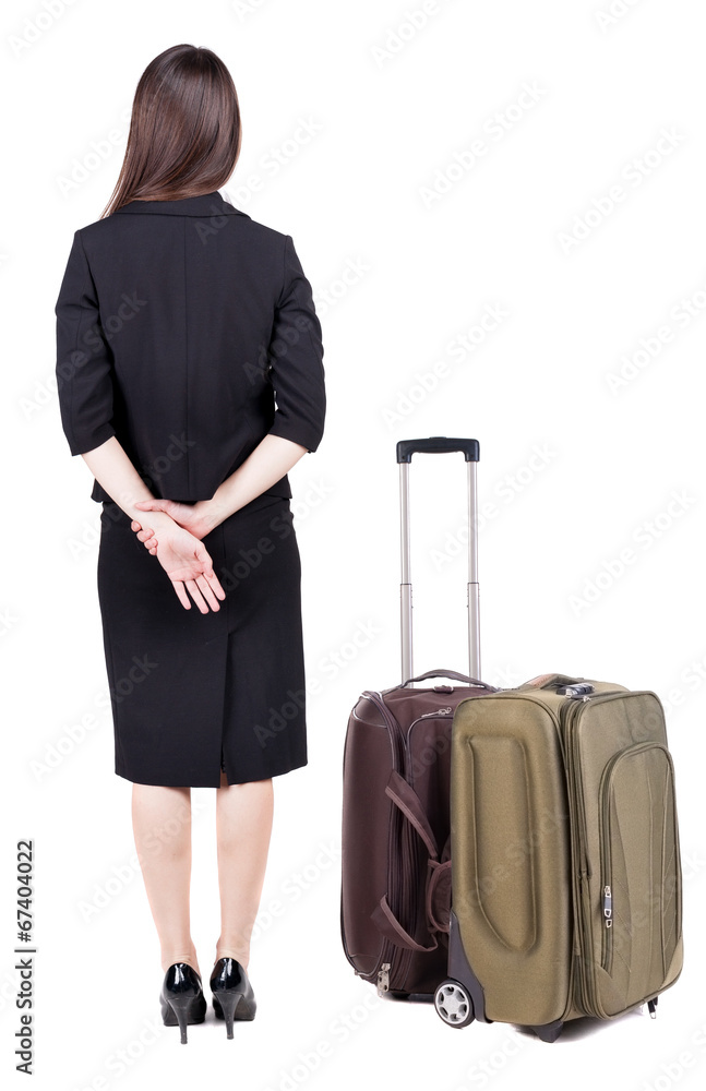 back view of thoughtful business woman traveling with suitcas. back view of thoughtful business woman traveling with suitcas.
