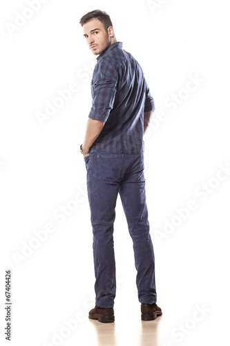 rear view of a young man in jeans