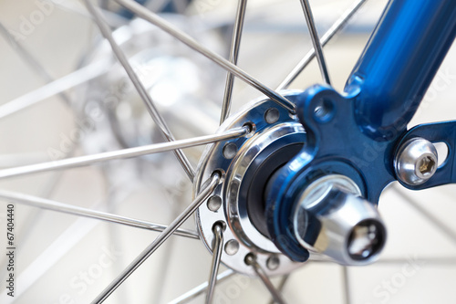 fragment of a bicycle wheel with shallow depth of field