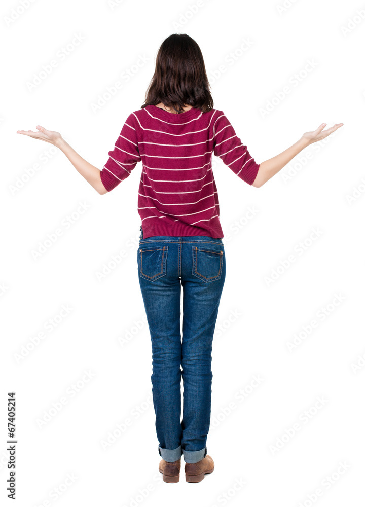 Back view of Beautiful woman holds hand up. Back view of Beautiful woman holds hand up.