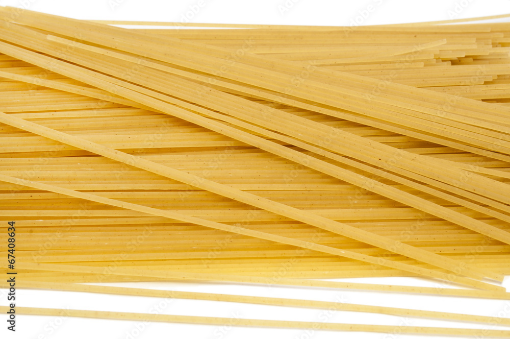 Uncooked spaghetti on a white background Uncooked spaghetti on a white background