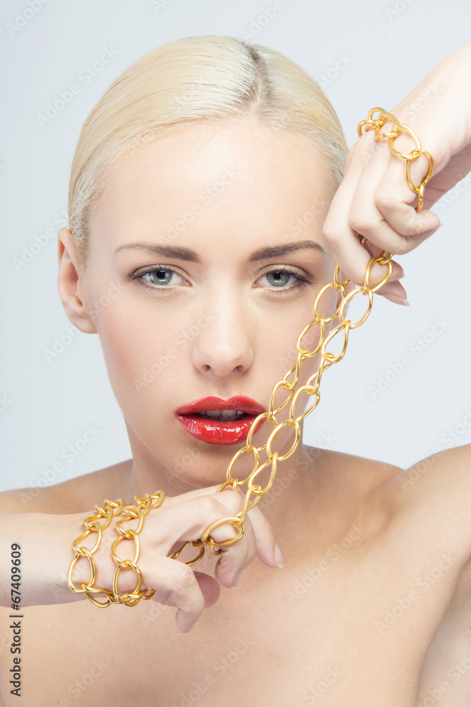 Young beautiful woman with neck chain StockFoto Adobe Stock